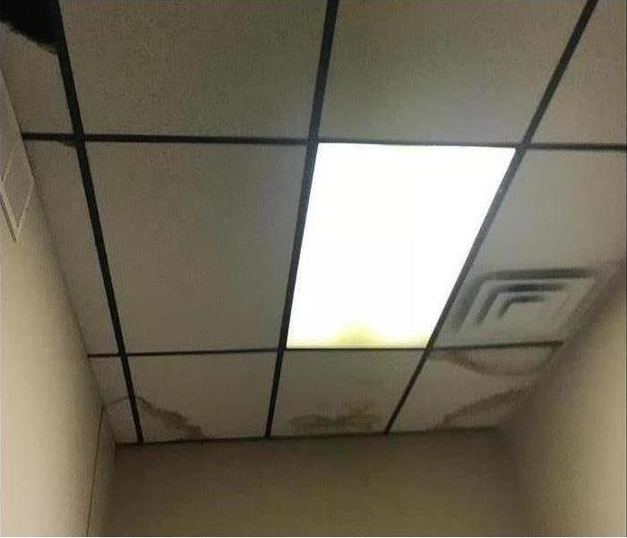 Ceiling tiles with visible water damage in Rossford, Ohio