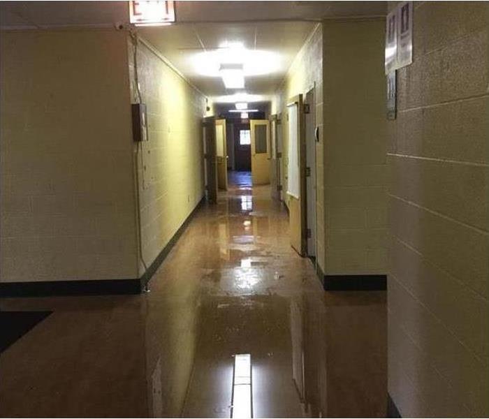 Toledo School Hallway flooded with water
