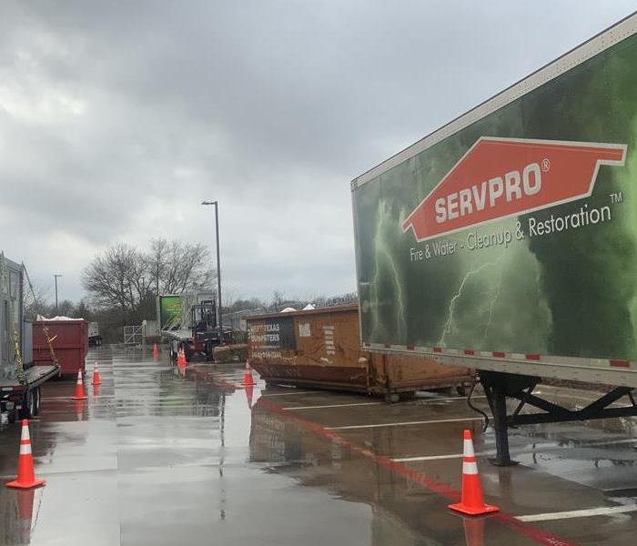 SERVPRO truck and equipment outside on a rainy day